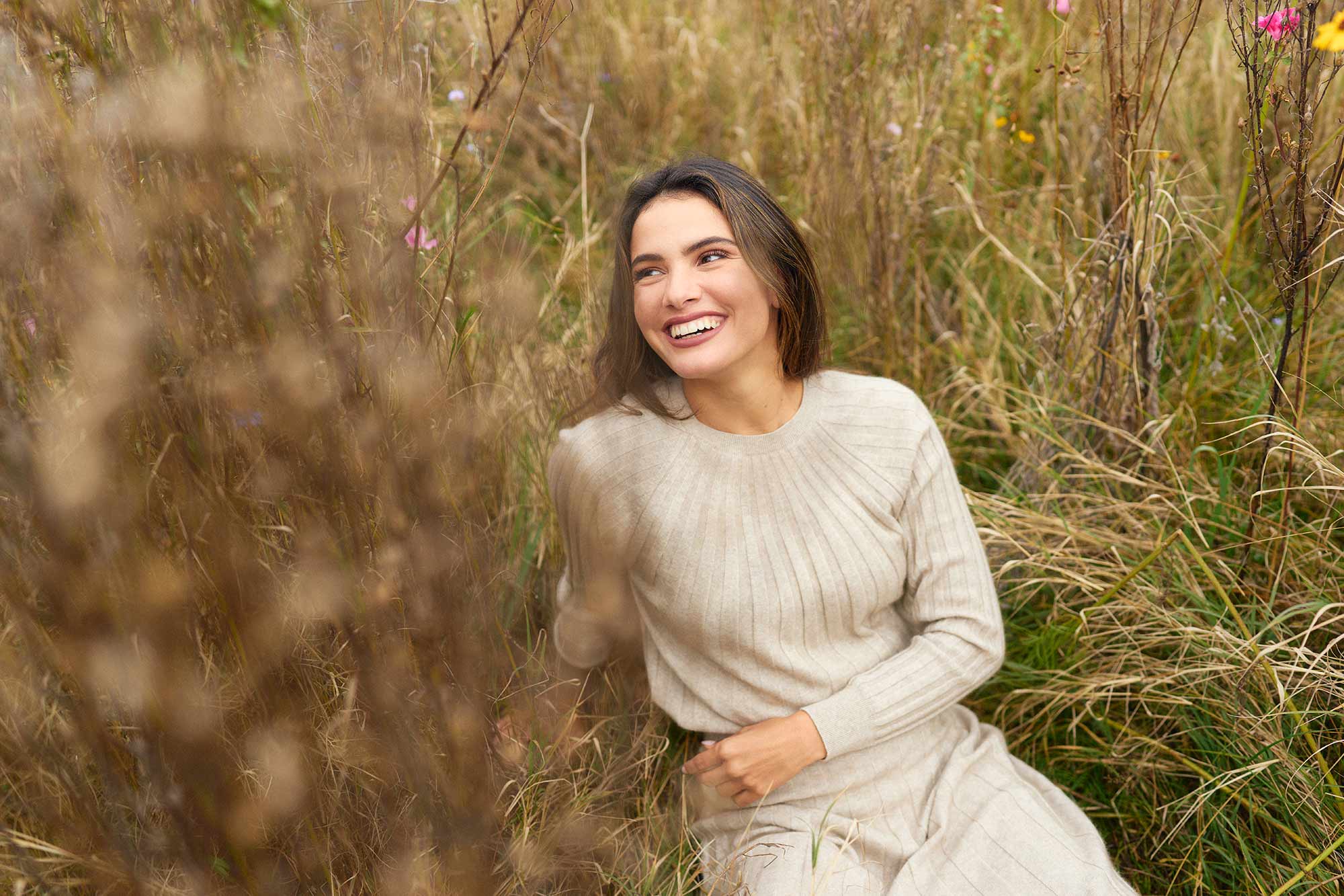 Boho-Inspired Fashion Model Posing in a Flowing Dress with neutral Coloured Top photographed in Hagley Park New Zealand for untouched world campaign