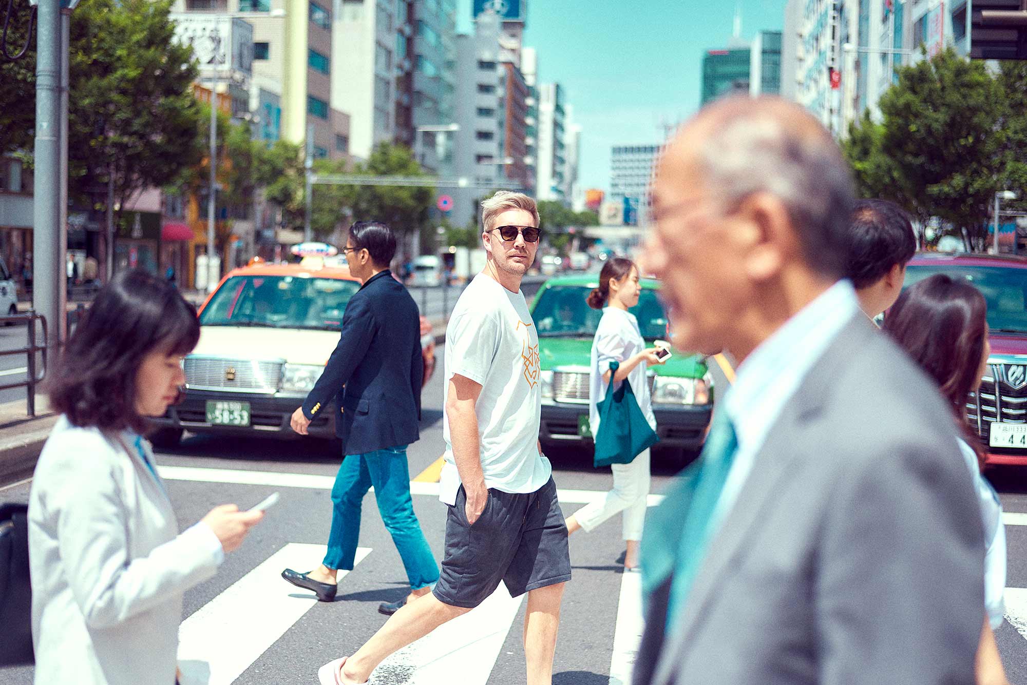 model walking the streets of Shibuya Tokyo for ASICS Japans latest sporting apparel